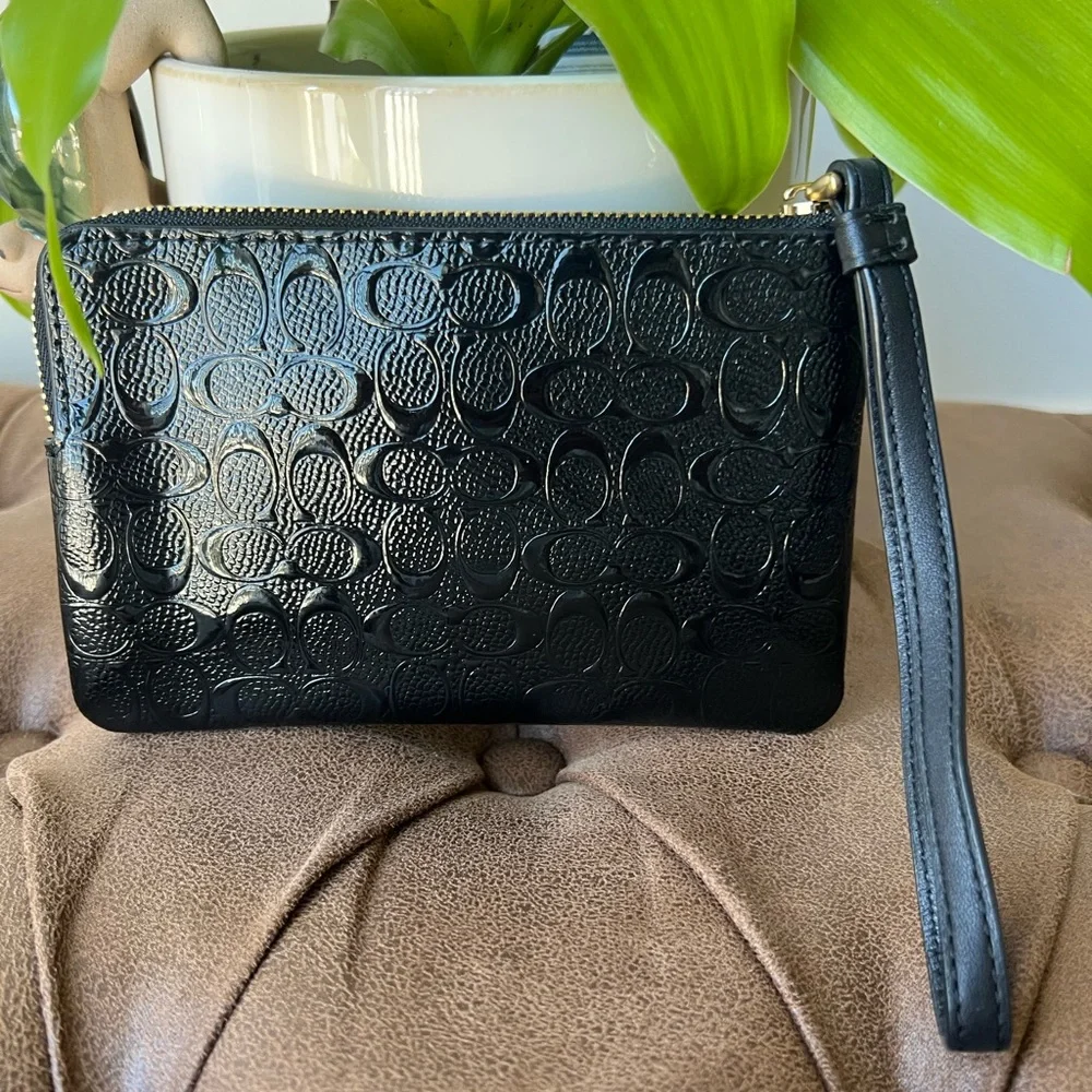 Coach F58034 Corner Zip Wristlet in Black Signature Debossed Patent Leather.